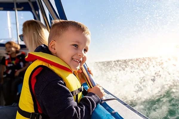 Family boating on Okanagan Lake